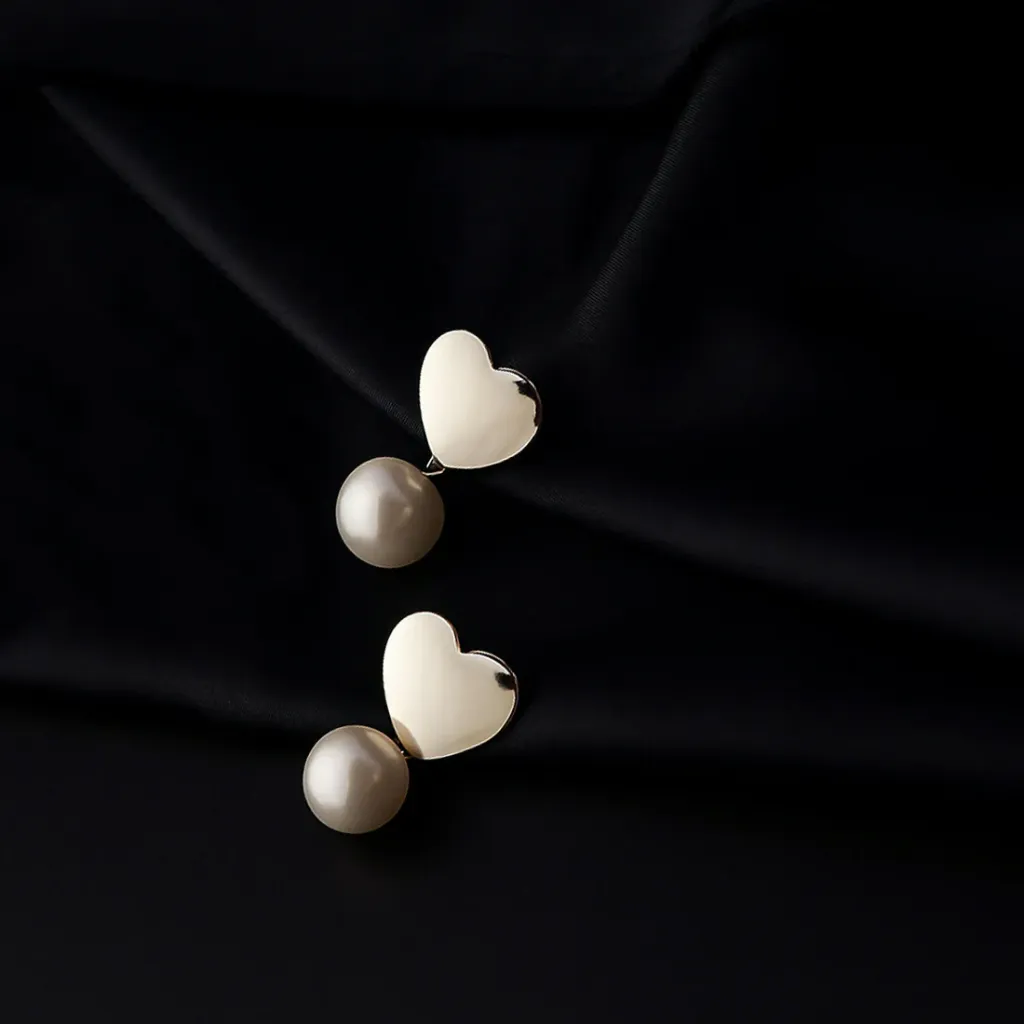 Heart-Shaped Stud Earrings with Dangling Pearls in Elegant Display Case